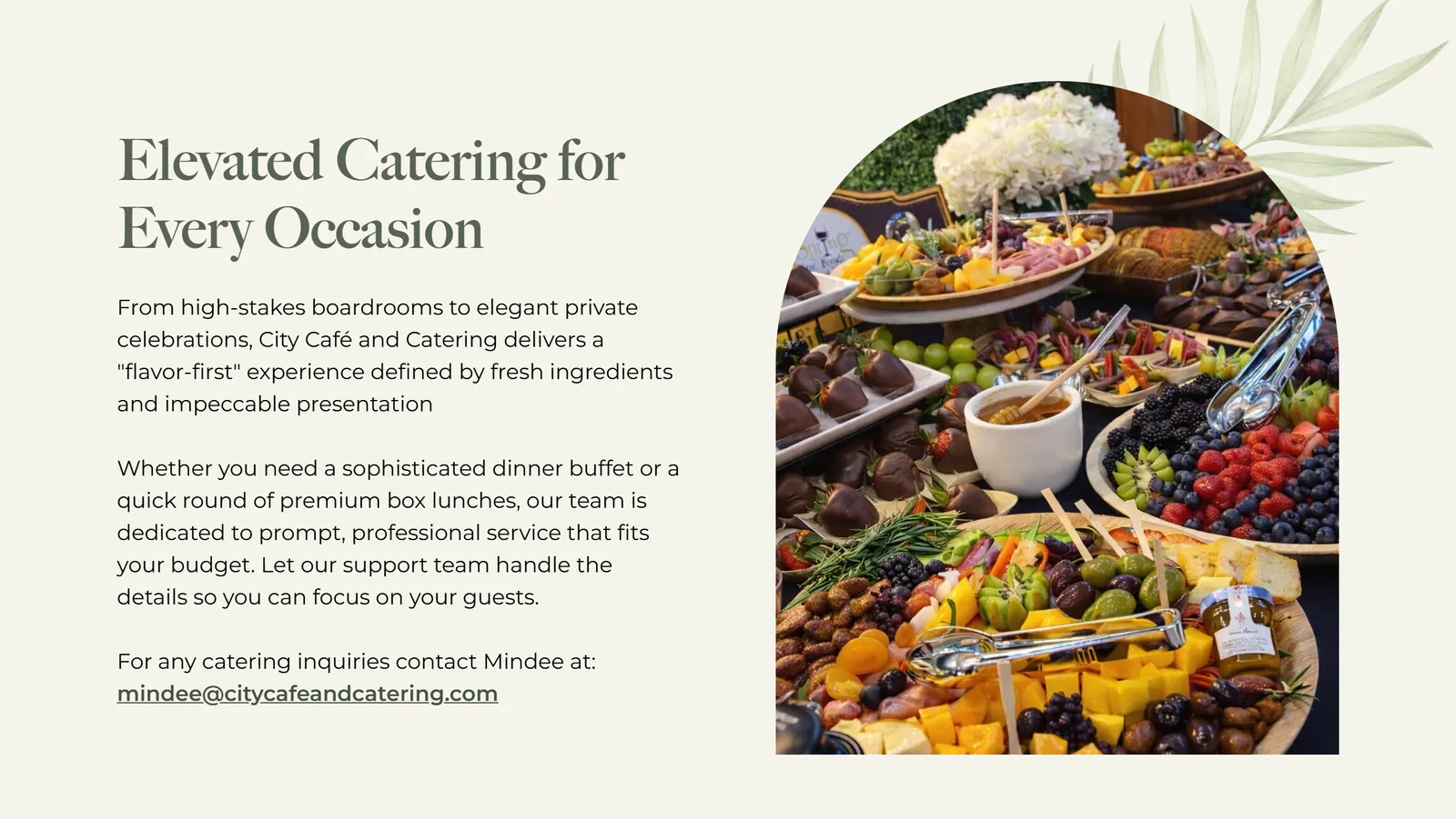 The top of the City Café catering page: the headline Elevated Catering for Every Occasion, two paragraphs about boardroom events, private celebrations, dinner buffets and box lunches, and the line For any catering inquiries contact Mindee at mindee@citycafeandcatering.com, beside an arched photo of a catering spread with fruit, cheeses, olives and chocolate-covered strawberries.