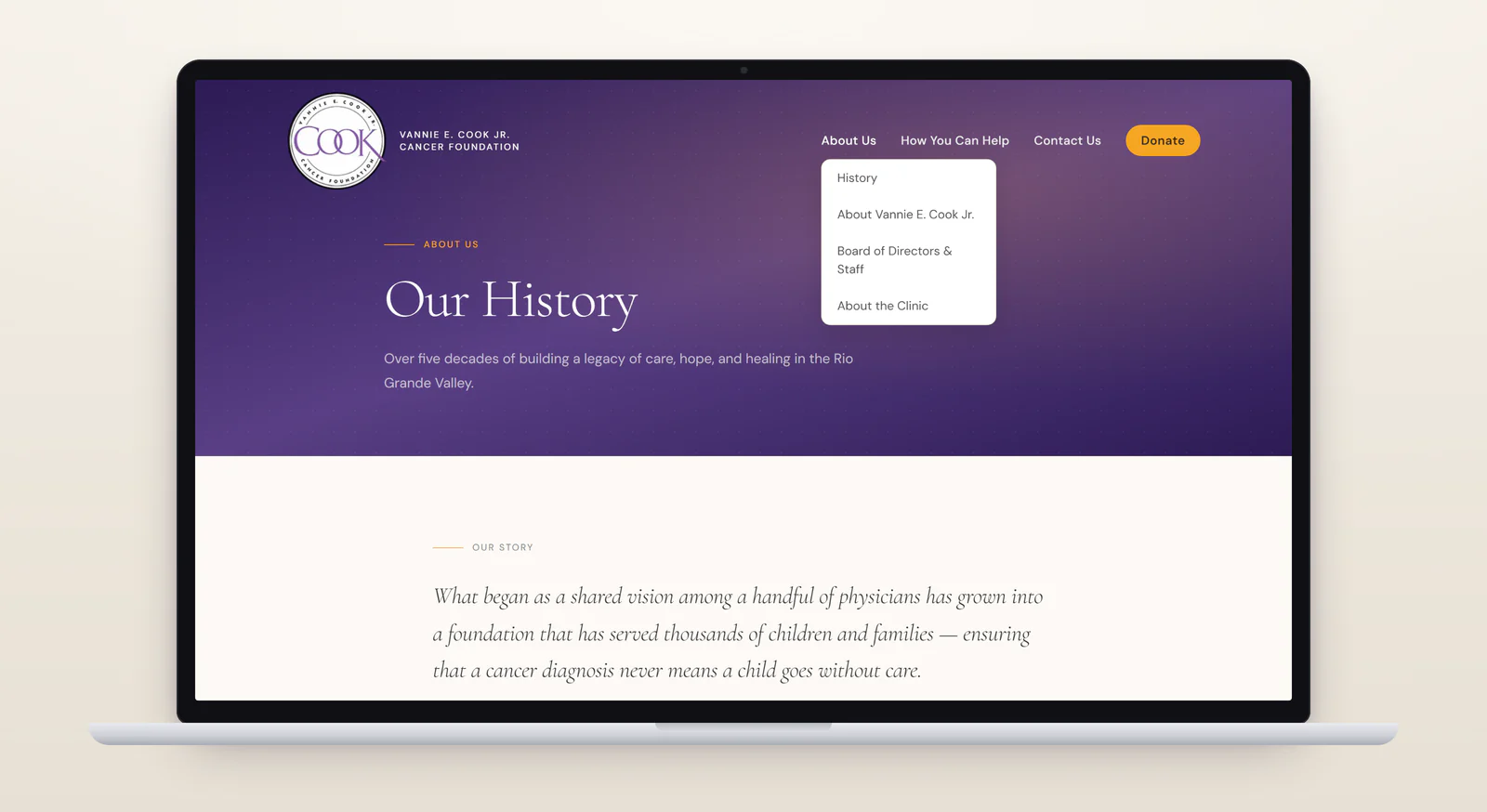 The Our History page on a laptop, with the About Us menu open to History, About Vannie E. Cook Jr., Board of Directors & Staff and About the Clinic, above the page's opening quote about a shared vision among a handful of physicians growing into a foundation that has served thousands of children and families.